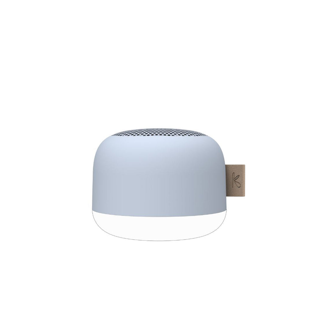 Waterproof Bluetooth bathroom speaker in cloudy blue resting on a white surface