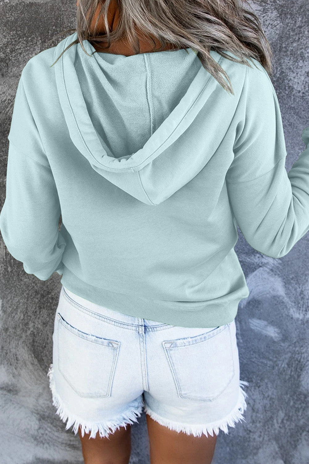 Comfortable black hooded sweater, back profile