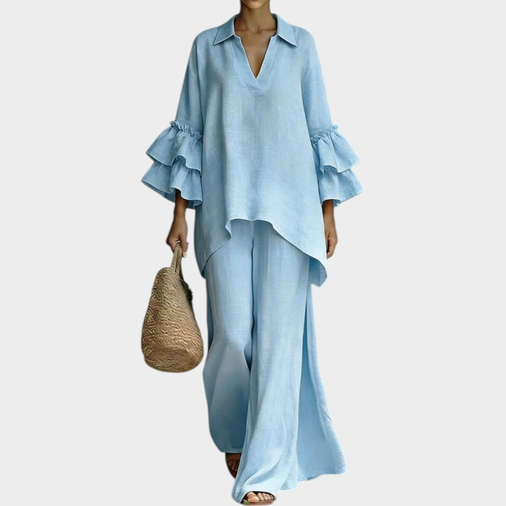 Casual chic resort wear outfit featuring short ruffle sleeves and matching trousers