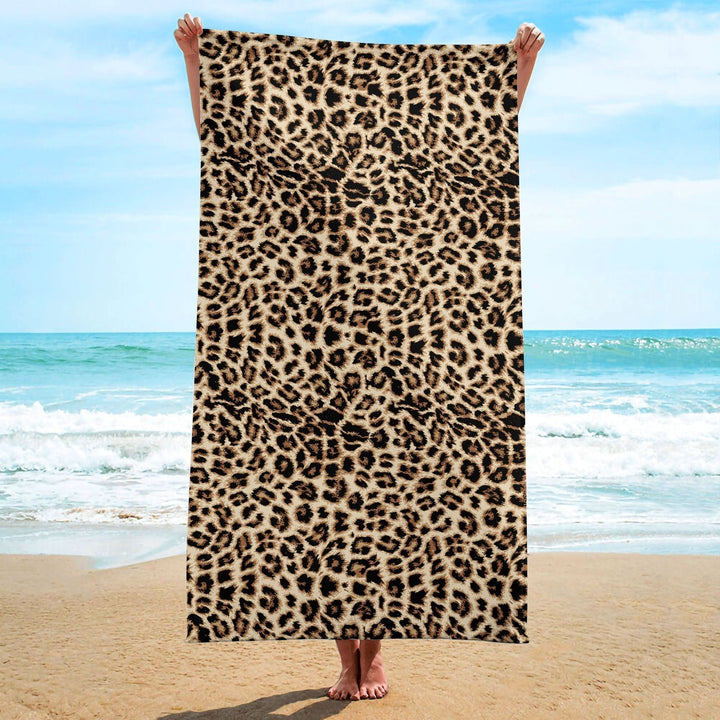 Animal print quick-drying microfibre beach towel folded neatly