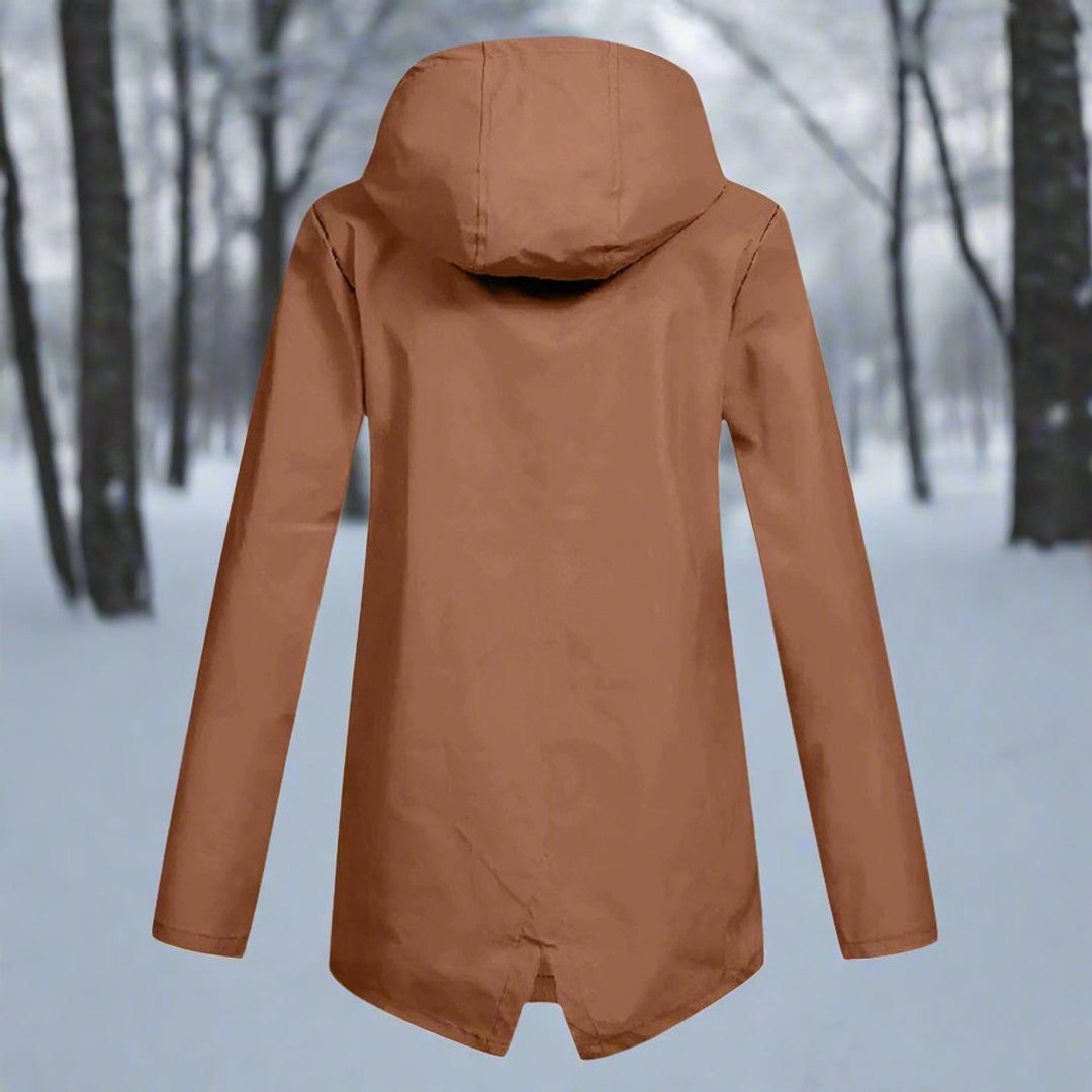 Back view of hooded outdoor rain jacket for women with tailored fit