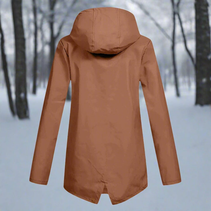 Back view of hooded outdoor rain jacket for women with tailored fit