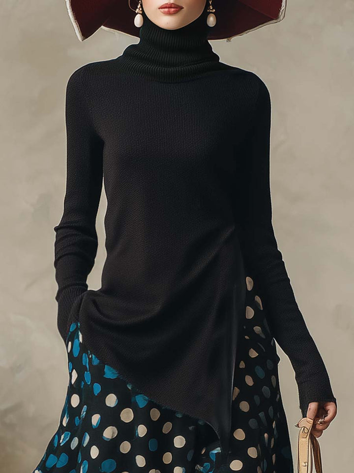 Close-up of the black high-neck knitted top with side slit detail
