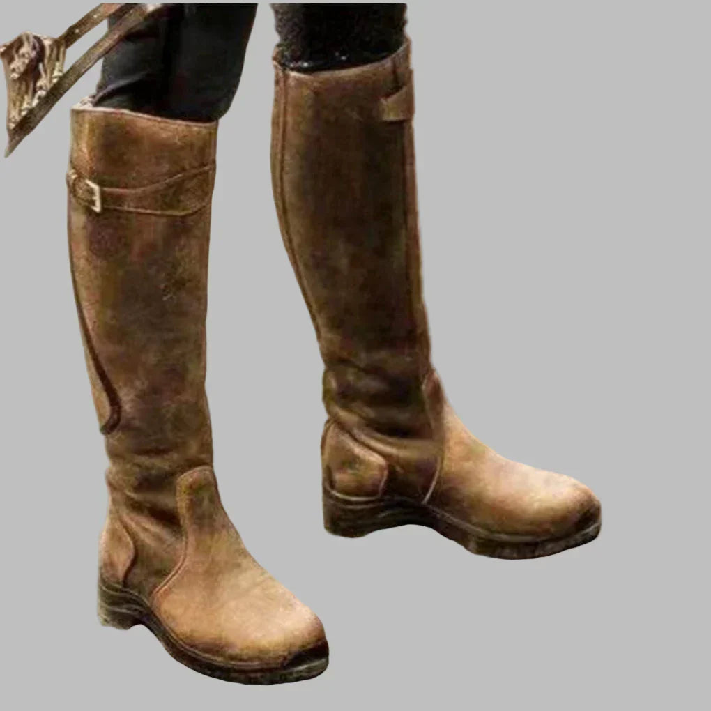 Full view of brown tall boots worn outdoors