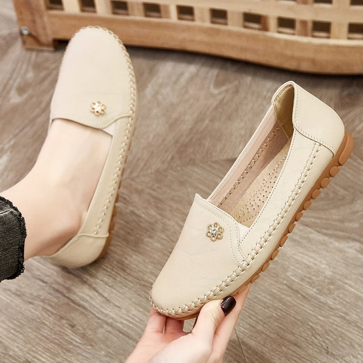 Comfortable pink slip-on walking shoes for women, presented on a clean studio background from a top-down view.