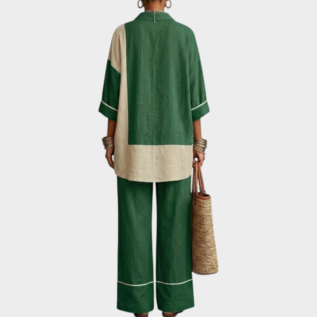 Back view of a woman showcasing the relaxed fit and draped silhouette of the green two-piece outfit.