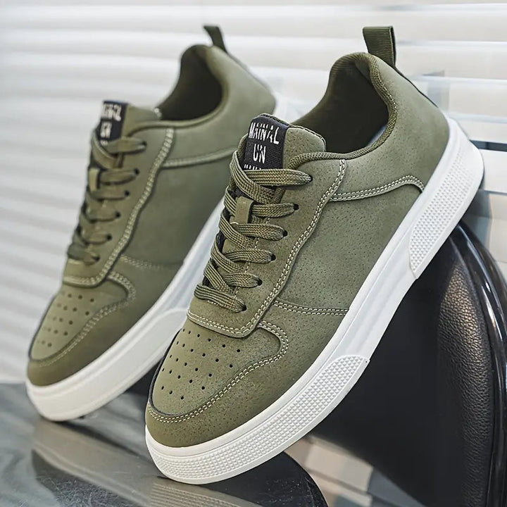 Green men's walking shoes with white sole and classic laces