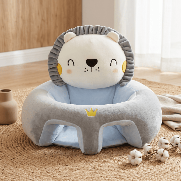 Empty blue and grey Little Lion baby sitting support seat on a woven rug