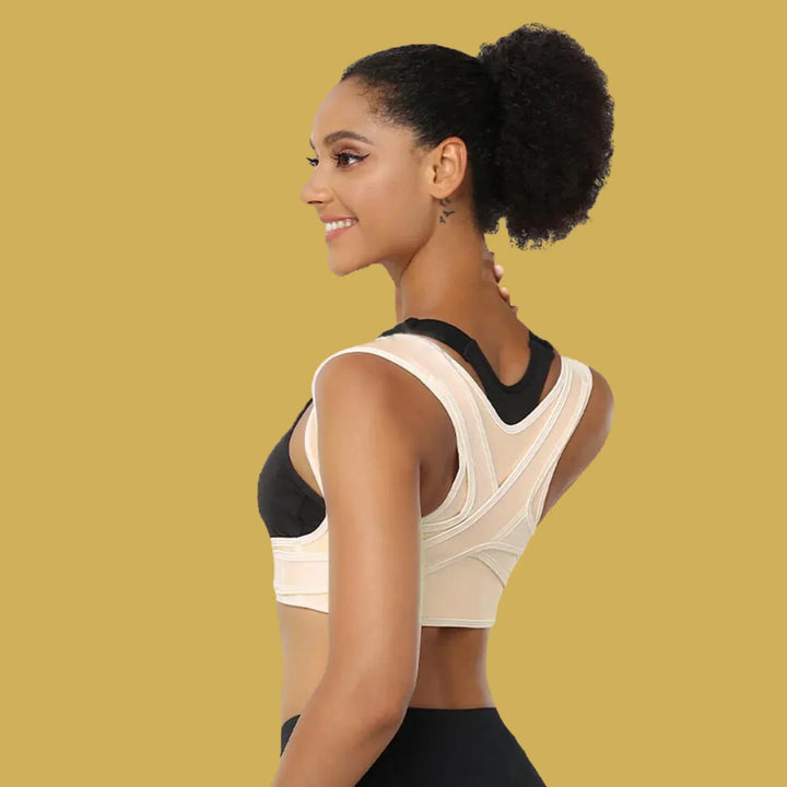 Woman wearing beige ergonomic back stabilizer for posture support