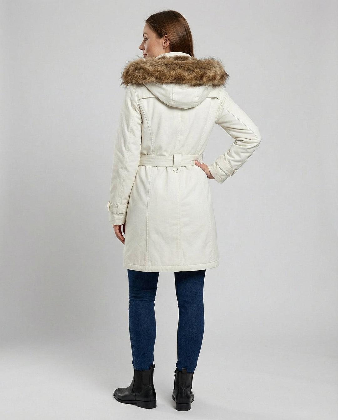 Close-up of fabric and zipper detail on warm women's winter coat, featuring durable quilted design.