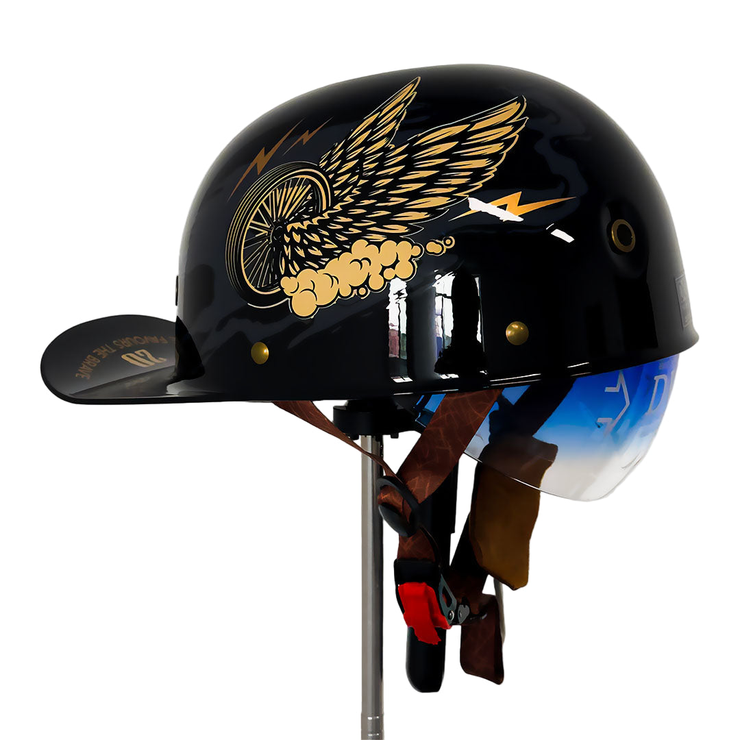 Side profile of a black baseball cap motorcycle helmet with graphic wings and blue visor