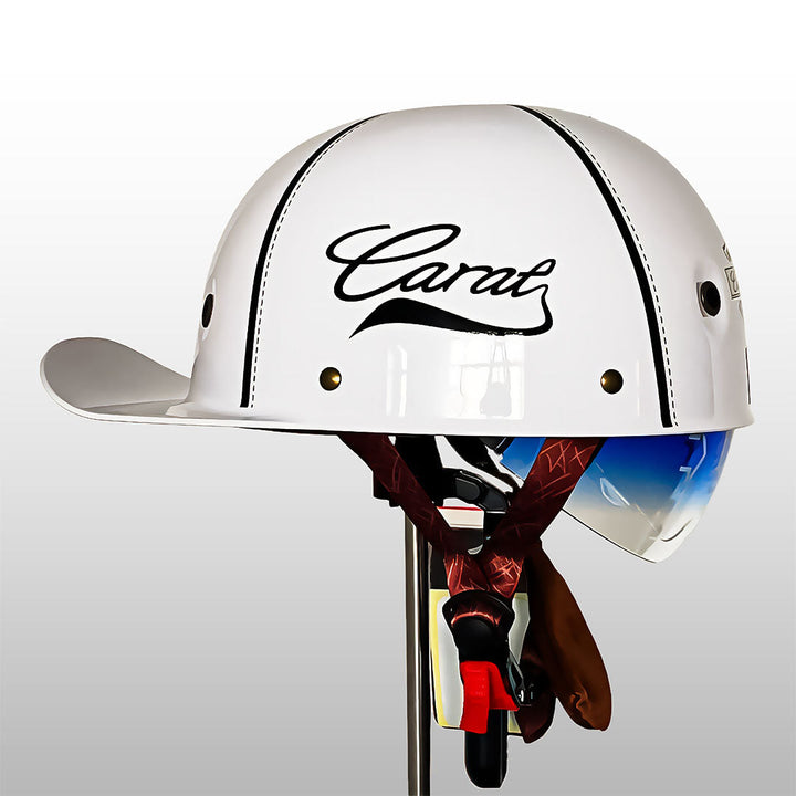 Cruiser half helmet with baseball cap aesthetic worn for urban riding and safety.