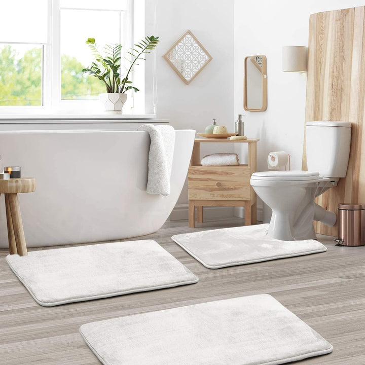 Machine washable absorbent memory foam bath mat set in a neutral tone.