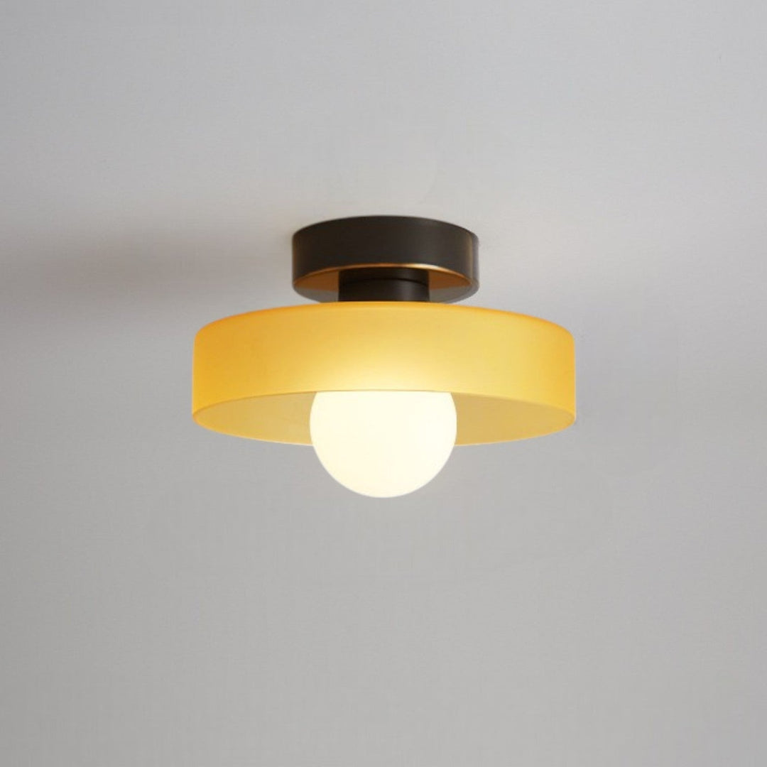 Close up of the elegant brass hardware on the spherical ceiling light