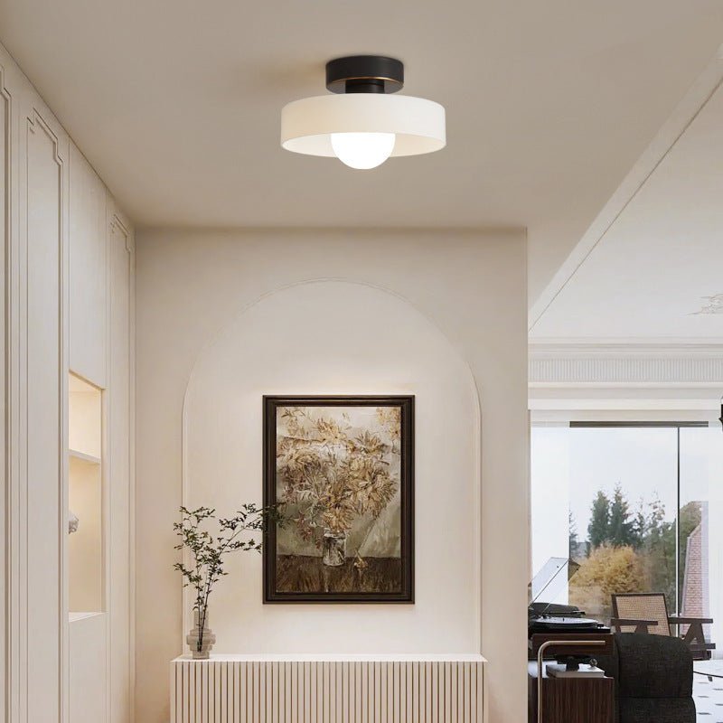 Modern bedroom hallway interior showcasing the black and white Bauhaus ceiling lamp installed