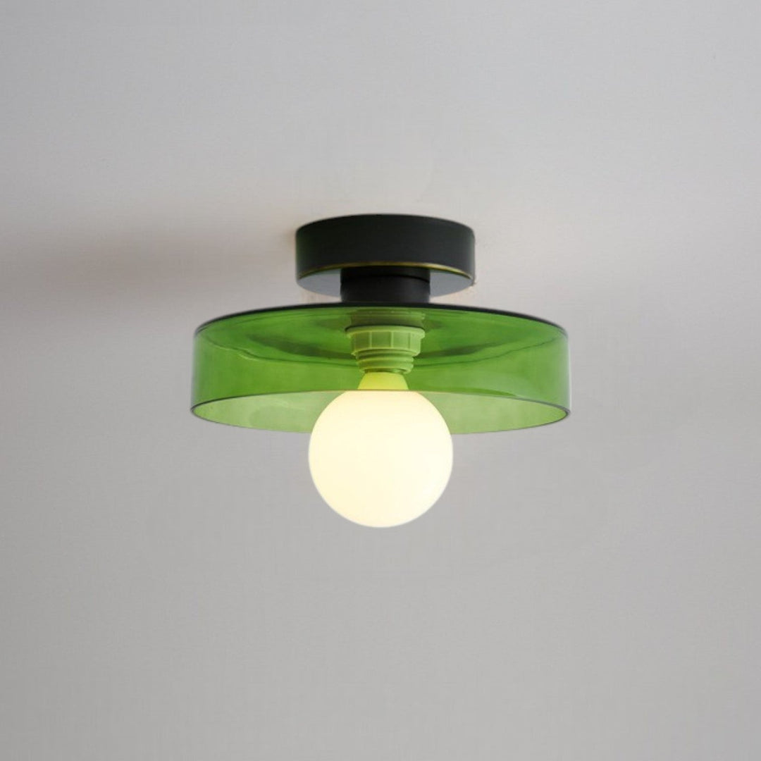Minimalist spherical light fixture viewed from a low angle perspective