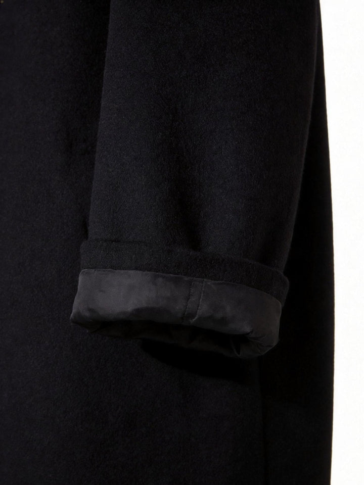 Interior lining detail of the men's long trench coat showing high-quality stitching.