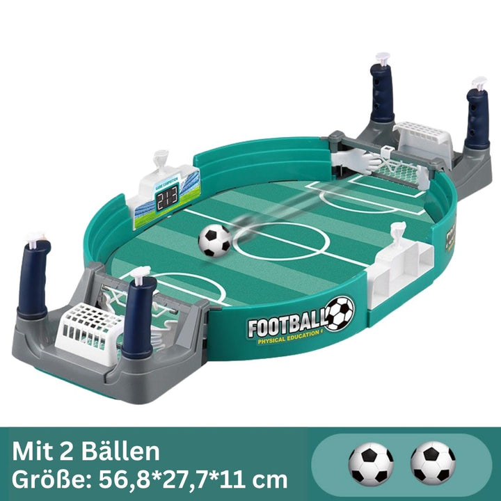 Kids playing with a mini table football game set in a living room setting