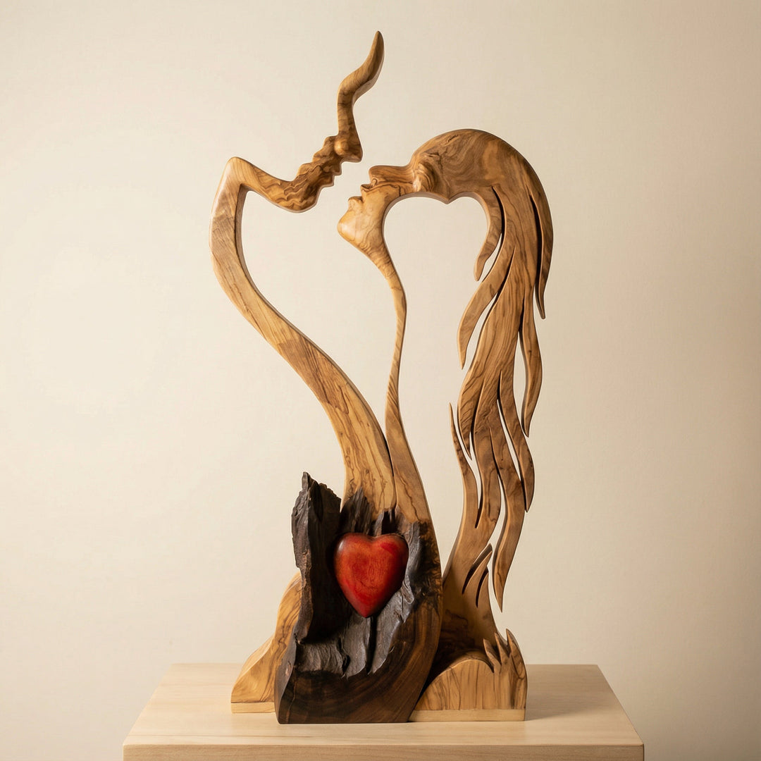 Handcrafted wooden couple sculpture featuring an abstract design with a red heart accent.
