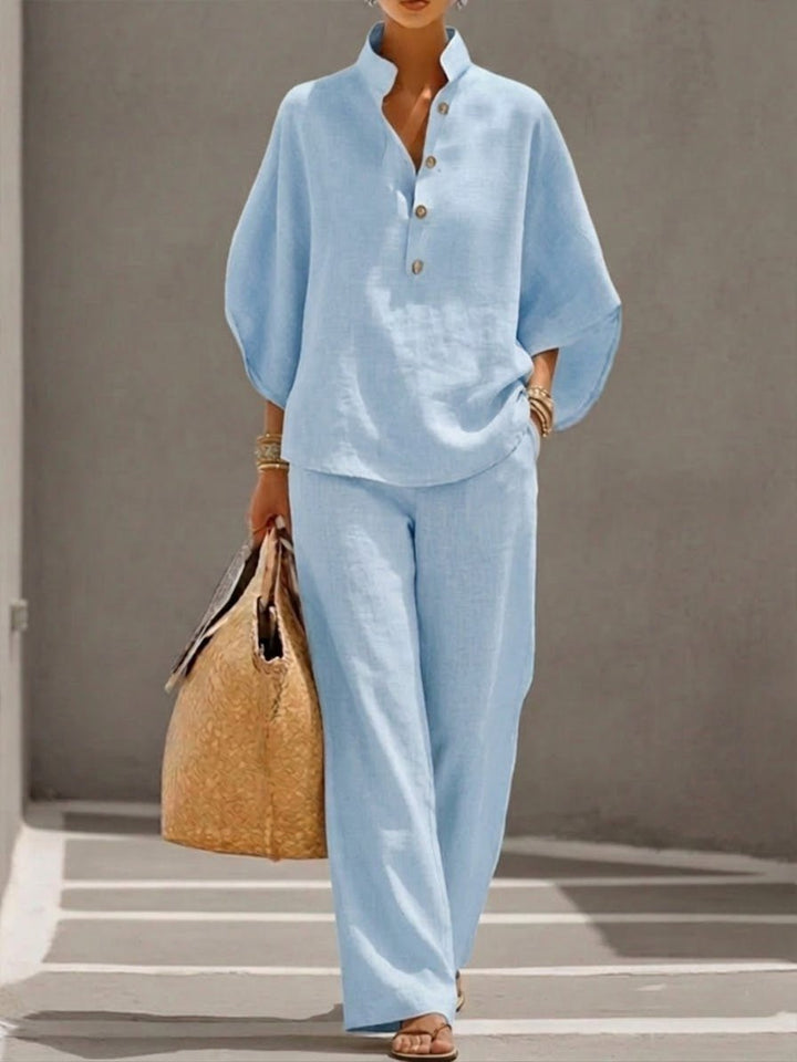 Full view of women's two-piece set with batwing top and wide leg pants
