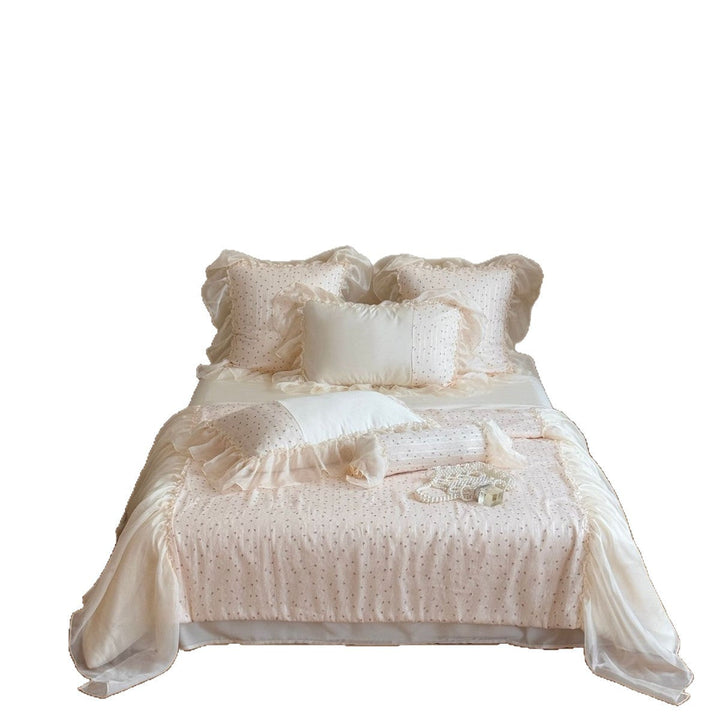 Elegant bedroom decor featuring ruffled chiffon bedding set and pillows