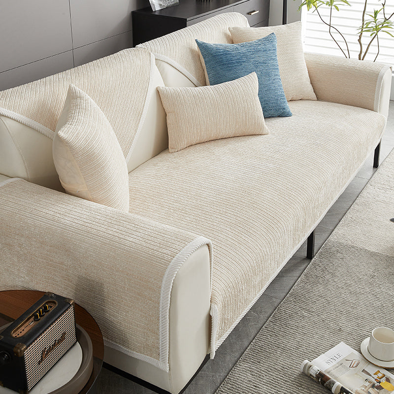Beige scratch-resistant sofa cover with matching pillows