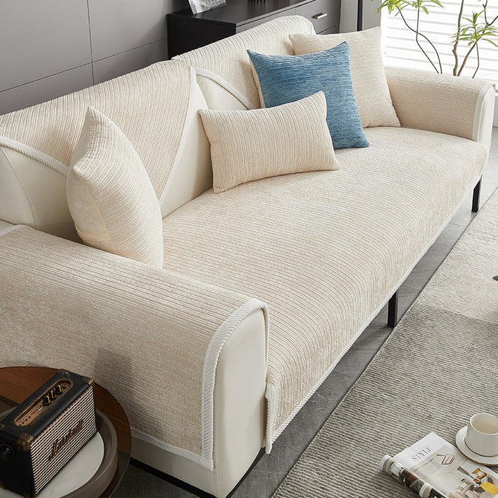 Beige scratch-resistant sofa cover with matching pillows