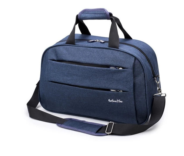 Travel bag interior displaying laptop sleeve and mesh organizer pockets