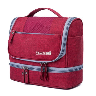 Travel organizer cosmetic bag hanging on a door, displaying full storage capacity and organization pockets