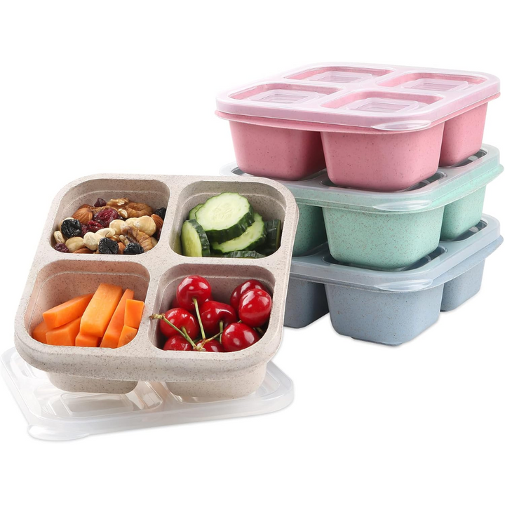 Stack of colorful bento-style 4-compartment meal prep boxes with fresh snacks
