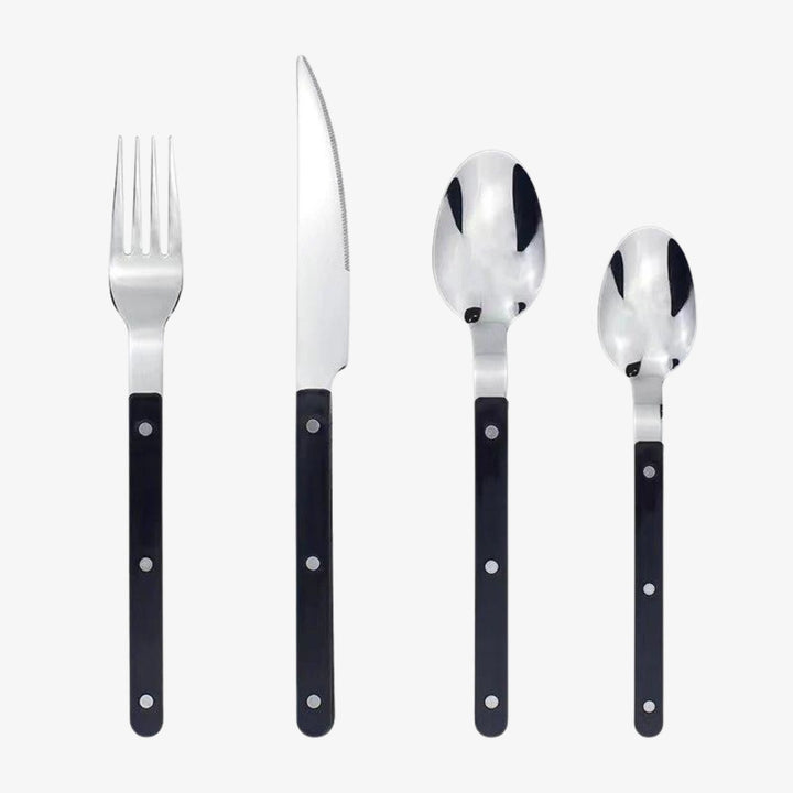Black stainless steel cutlery pieces including fork, knife, spoon, and teaspoon