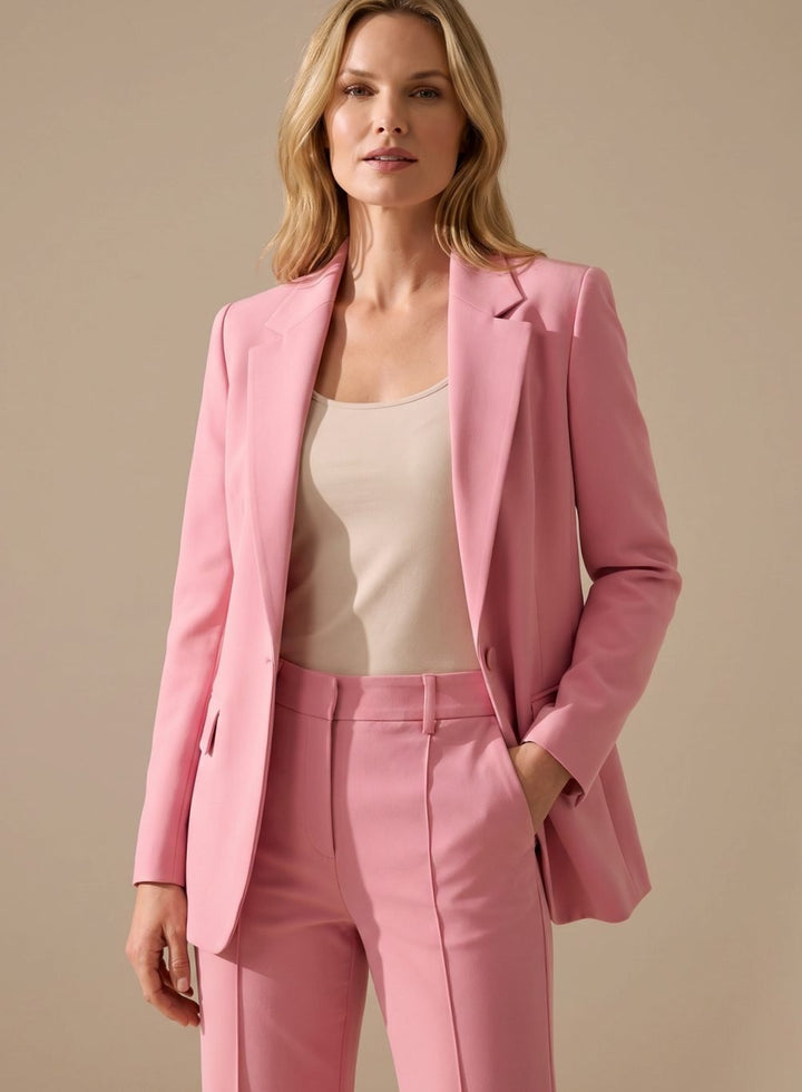 Close-up of the flared trouser hem and tailored crease lines