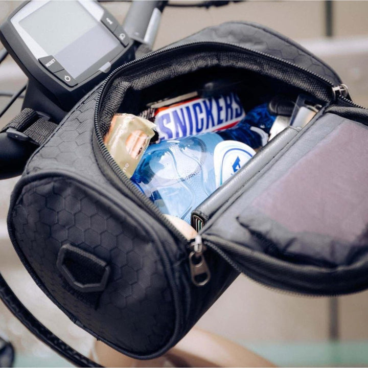 Open black bike handlebar bag showing spacious interior storage for snacks and essentials