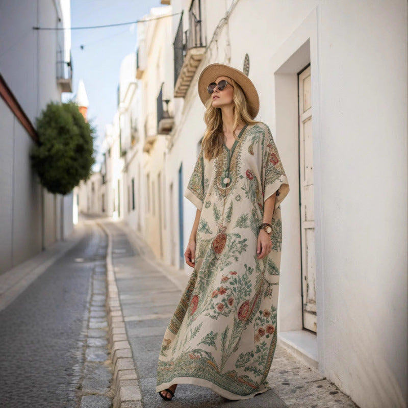 Woman wearing a beige floral maxi boho dress in a sunny street