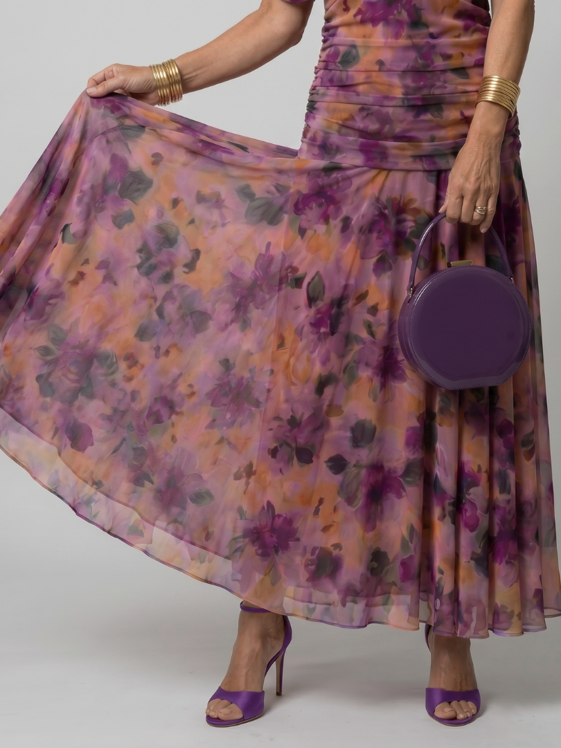 Close-up view of the draped floral fabric and ruched waist detail