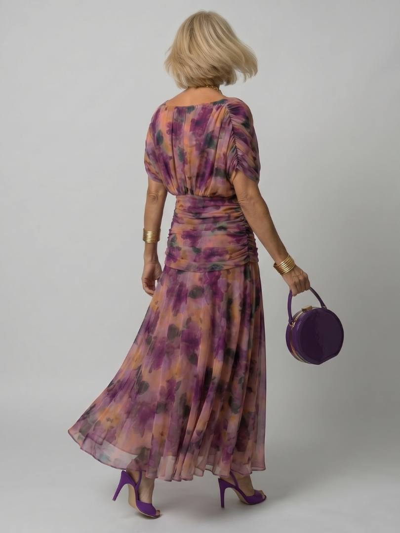 Back view of the flowing midi boho dress showcasing the flared skirt