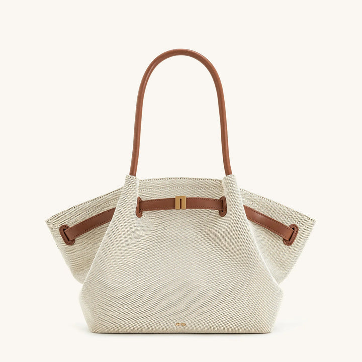 Versatile shoulder bag worn, demonstrating practical everyday style