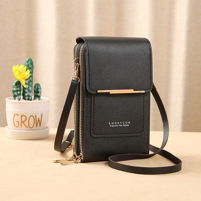 Crossbody phone bag worn by model demonstrating everyday accessories style