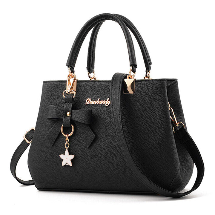 Flat lay of women's chic purse paired with everyday essentials and accessories