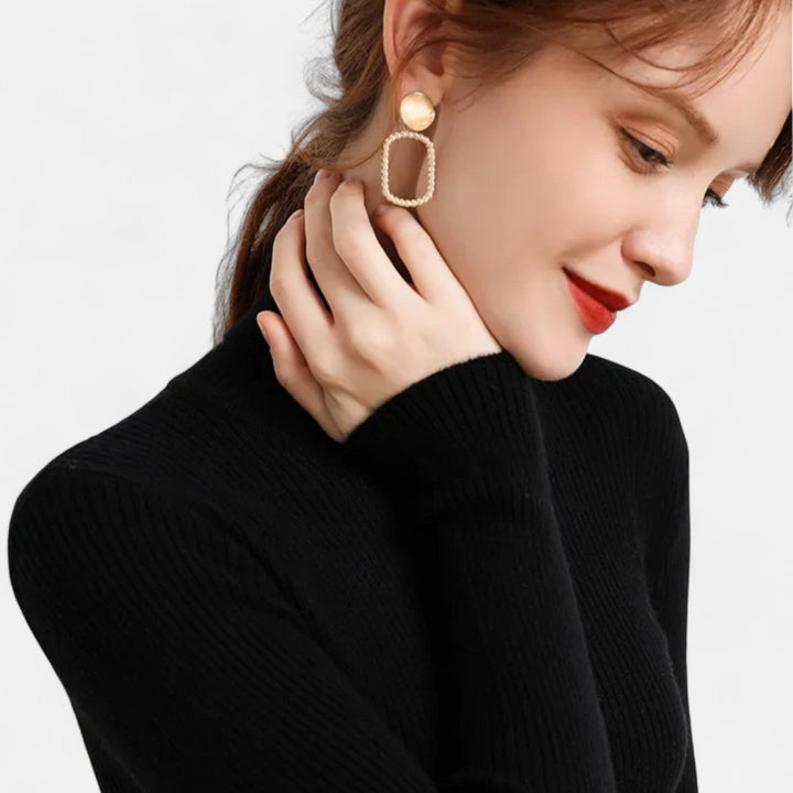 Womens sweater with cozy turtleneck collar and fitted silhouette