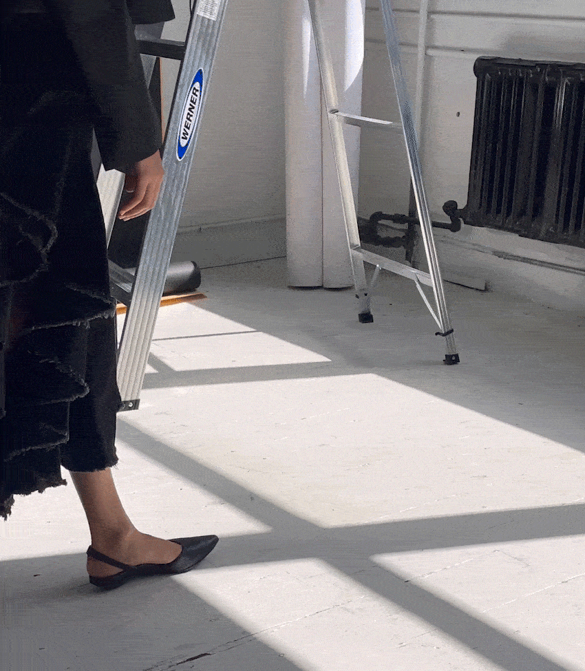 Pair of elegant women's black block heels displayed together