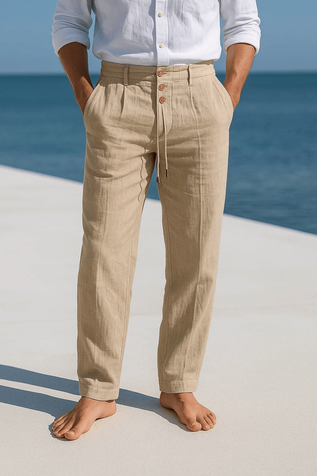 Man wearing khaki relaxed-fit summer trousers by the ocean