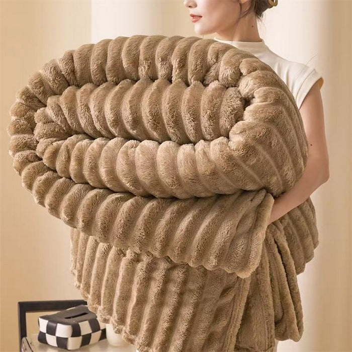 Detailed shot showing the heavy yarn weave of the cozy chunky knit sofa blanket.