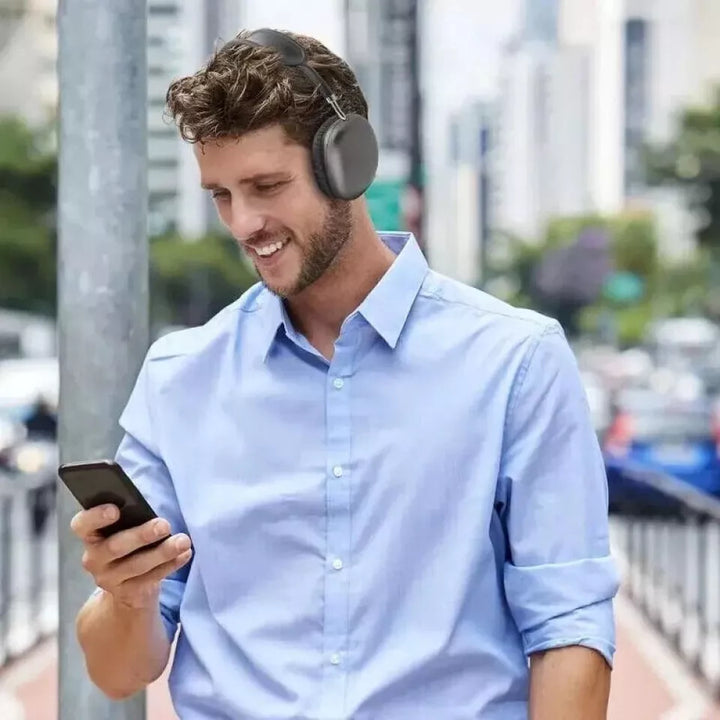 Close-up view of over-ear headphones control buttons and charging port