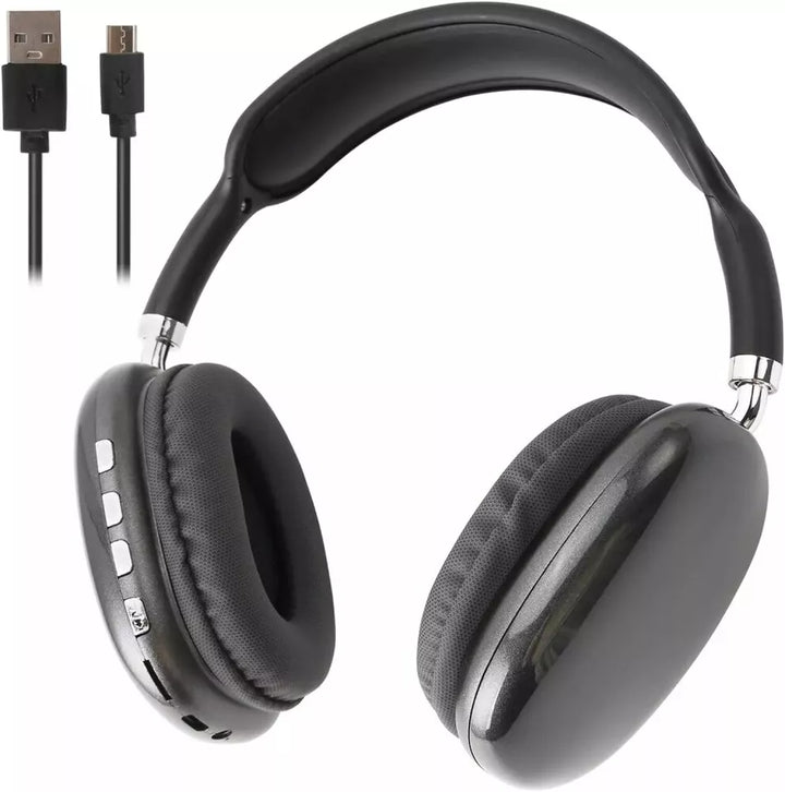 Wireless audio headset resting on a modern desk setup next to a smartphone