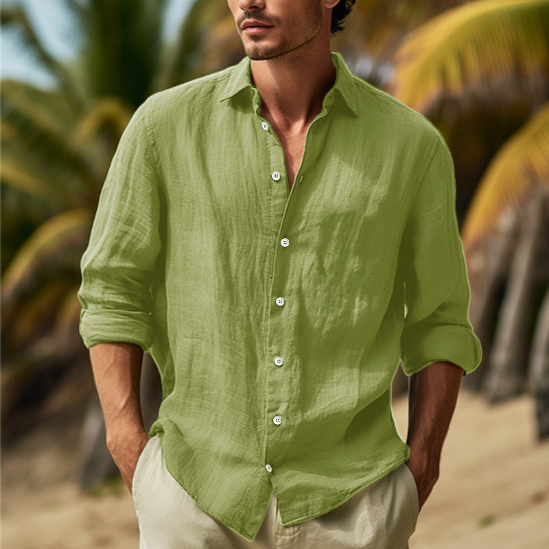 Man wearing green casual long sleeve button-down shirt outdoors