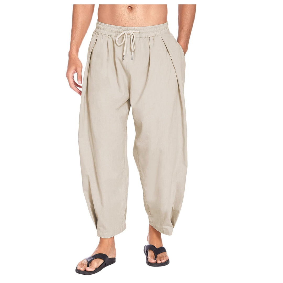 Man wearing khaki drop crotch harem pants with drawstring waist