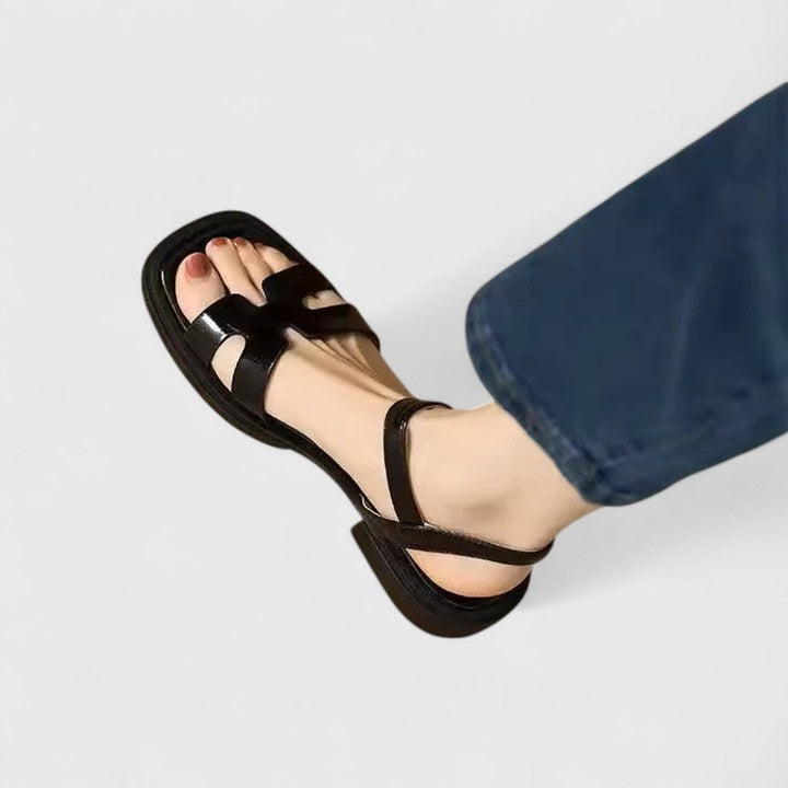 Close-up of women's comfortable ankle strap flat sandals for warm weather