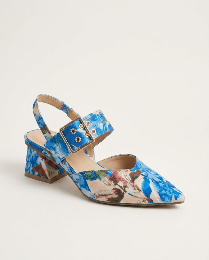 Elegant wedding guest blue slingback shoes resting on surface