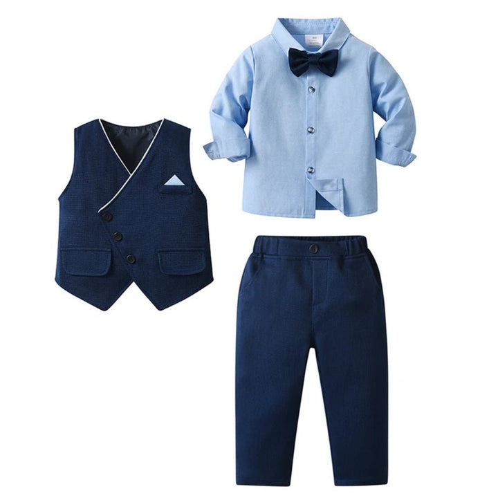 Flat lay display of a complete boys formal suit featuring a light blue shirt, waistcoat, and trousers